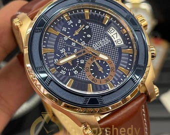 Vintage Guess-kalenderhorloge voor heren goud-zilver. Nieuw met kaartjes