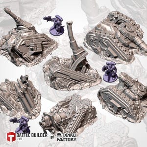 May include: A collection of gray miniature war machines, including tanks and missile launchers, are displayed on a white surface. Each model is intricately detailed with mechanical components and rests on a rocky base. Small purple figurines are also present.