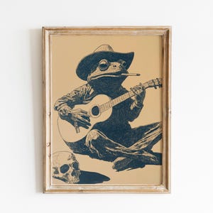 Rana vaquera tocando la guitarra / Arte mural de rana del oeste / Rana vaquera rústica / Rana vaquera divertida / Decoración vintage de rana del oeste / Arte de rana del oeste