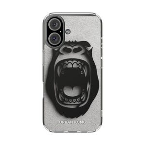 Op de afbeelding: Transparante telefoonhoes met een zwart gorilla-ontwerp, een open mond en zichtbare tanden, en de tekst "URBAN KONG". De achtergrond heeft een getextureerde, lichtgrijze uitstraling. De telefoonhoes heeft een dubbel camerasysteem.