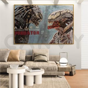 Puede incluir: Una obra de arte enmarcada que representa la película Alien vs. Predator. La imagen muestra a las criaturas icónicas enfrentándose, con el texto del título de la película visible. La paleta de colores incluye tonos grises, marrones y rojos.