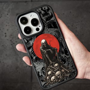May include: Black phone case featuring a grim reaper design. The artwork includes a red moon, skulls, and a figure in a hooded cloak. The case has a black border and a detailed, gothic-inspired illustration.