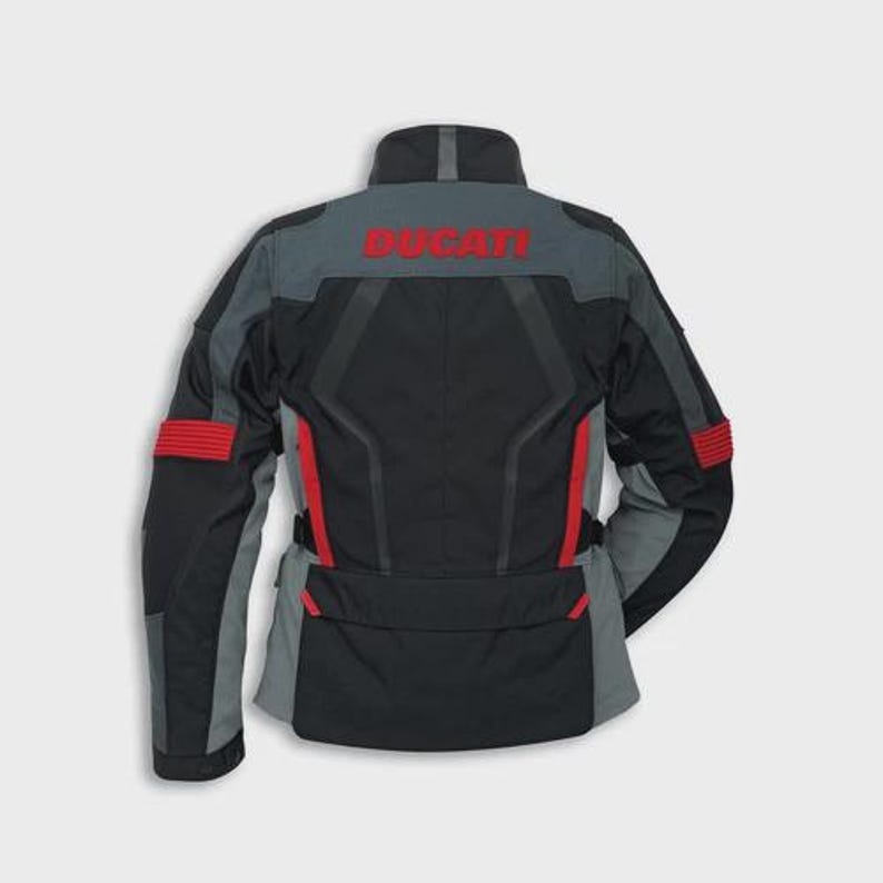 May include: Black and gray motorcycle jacket with red accents. The jacket features the word "DUCATI" in red across the upper back. The jacket has a high collar and multiple panels for a tailored fit.
