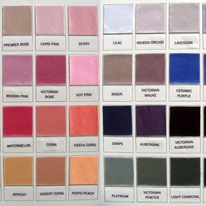 May include: A color chart with 48 fabric swatches, each labeled with a color name. The swatches are arranged in rows and columns, with the colors ranging from pink to purple to black.