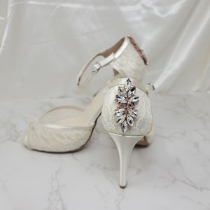 Ivory lace bridal shoes with rose gold design