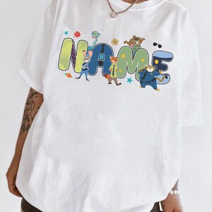 Camiseta personalizada con nombre de los personajes de Zootrópolis 2, Camiseta de Judy Hopps y Nick Wilde de Zootrópolis, Camiseta familiar para viaje a Disneyland, Reino Mágico imagen 2