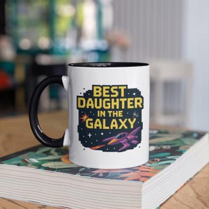 Best Daughter in the Galaxy Mug, Pixel Art Retro Gamer Gift, Fun Space Battle Coffee Cup for Kids, Teens, and Family Game Nights