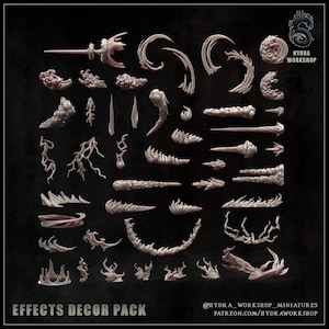 May include: A collection of unpainted light-coloured resin miniature spell effects including various shapes of magical energy, smoke, lightning bolts, and elemental blasts. The set is labelled Effects Decor Pack and Hydra Workshop.