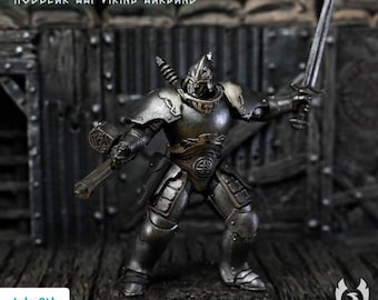 May include: A miniature figurine of a warrior in metallic armour, holding a sword in one hand and a firearm in the other. The figure wears a helmet and chest plate with intricate details. Text reads: TRENCHES OF MIDGARD 2 MODULAR WWI VIKING WARBAND.