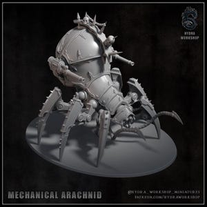 May include: A grey mechanical arachnid miniature with a spherical body, multiple legs, and weaponry. The model has intricate details, including spikes, skulls, and mechanical components. The text "MECHANICAL ARACHNID" is at the bottom.