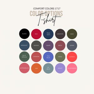 May include: A color chart for Comfort Colors 1717 T-shirts, featuring a variety of hues. The chart includes colors like black, red, true navy, graphite, and sage, along with other options such as midnight, pepper, and grape. The text "COLOR OPTIONS T-shirt" is displayed.