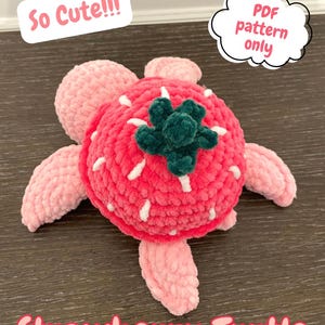 May include: A handmade strawberry turtle plushie in shades of pink and red. The turtle has a red body with white accents, green leaves, and pink flipper-like limbs. Text on the image reads "So Cute!!!" and "PDF pattern only" and "Strawberry Turtle".