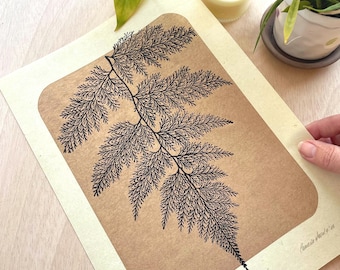 Fern leaf relief print, black on golden background,