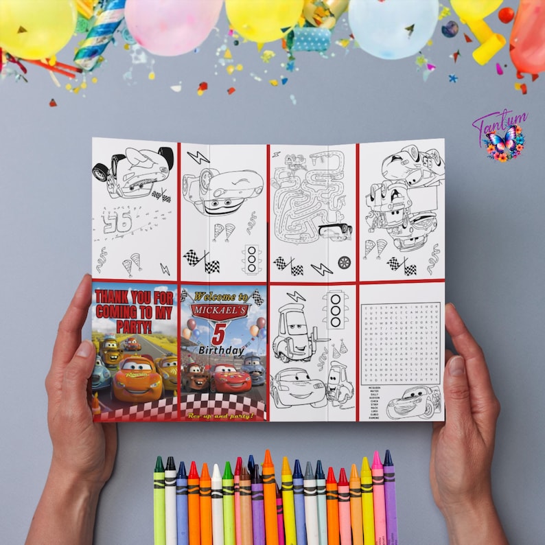May include: A birthday party activity booklet featuring Cars characters, held by hands. The booklet includes coloring pages, mazes, and a word search. A box of colorful crayons is at the bottom. The text reads "Thank you for coming to my party!" and "Welcome to Mickael's 5th Birthday."