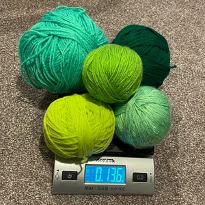 Yarn destash multi green bundle skein plus solid.  Perfect for your imagination