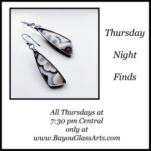 May include: A pair of teardrop-shaped earrings with a silver-colored metal frame. The earrings feature a patterned, light-colored stone with shades of white, gray, and brown. The text "Thursday Night Finds" is also visible.