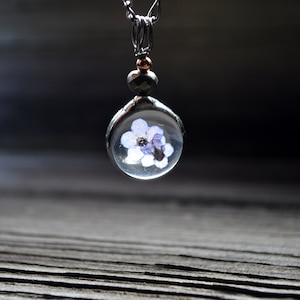 Dainty forget me not pendant, real dry pressed flowers in glass and metal necklace, adorned with a copper and pyrite bead. This charm is delicate and romantic making it a perfect gift for Mom wife girlfriend birthday anniversary remembrance memorium