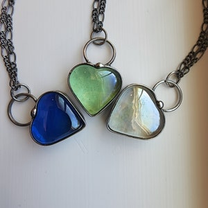 Chunky Heart Necklace in 3 colors Blue, Green and Clear. Handmade translucent Glass Heart Pendants are weighty and elegant and simply go with any outfit. Artisan Crafted in Louisiana at Bayou Glass Arts studio.