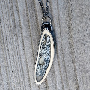 Handmade Ceramic Dragonfly Wing Pendant, in blue, encased in metal. Designed by Louisiana Artisans at Bayou Glass Arts in USA.