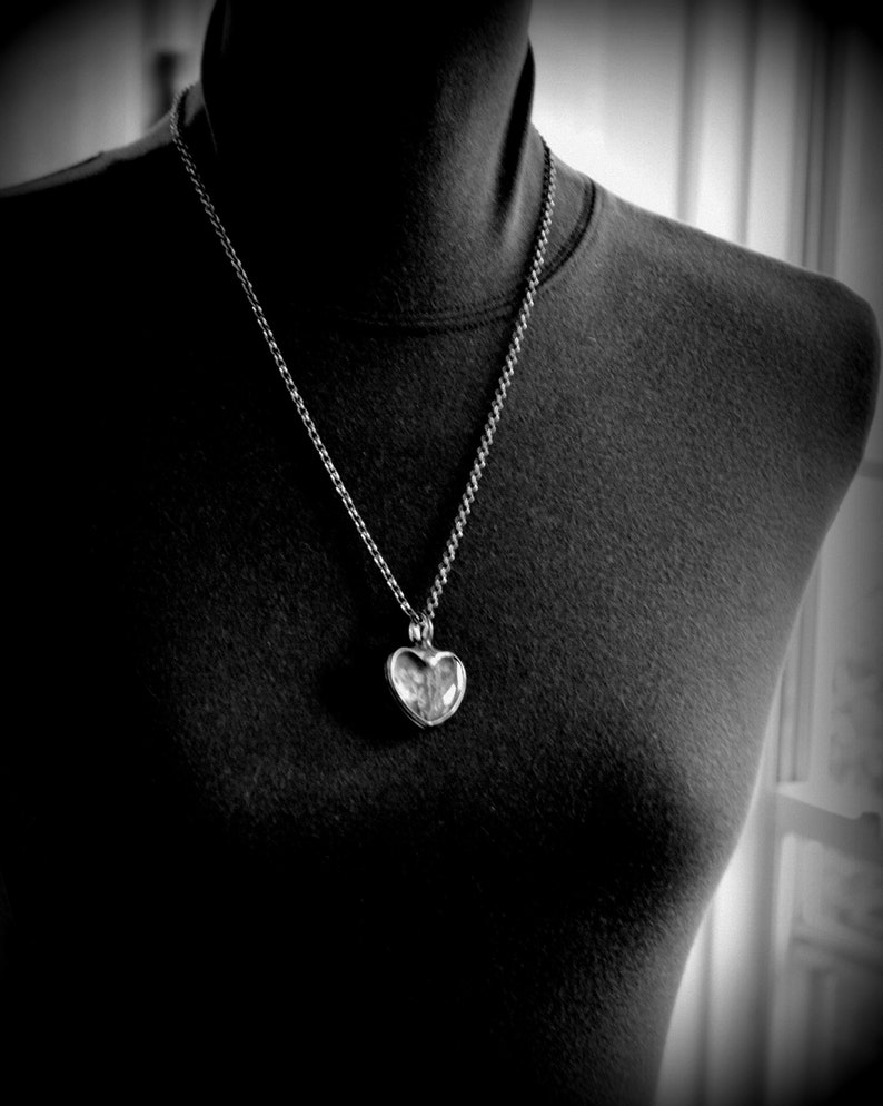 Model wearing Forget Me Not Heart Pendant Necklace Handmade by Artisan at Bayou Glass Arts. 2 dry pressed flower blooms encased in heart shaped cabochons. In remembrance. Best gift for Mom Grandma BFF Girlfriend Christmas Birthday Anniversary