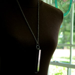 Piano Key Necklace, shown here on model to show length of chain, 100 year old black ebony key Handmade by Bayou Glass Arts into an interesting piece of jewelry. Best gift for piano or music teacher or any piano player in you life.