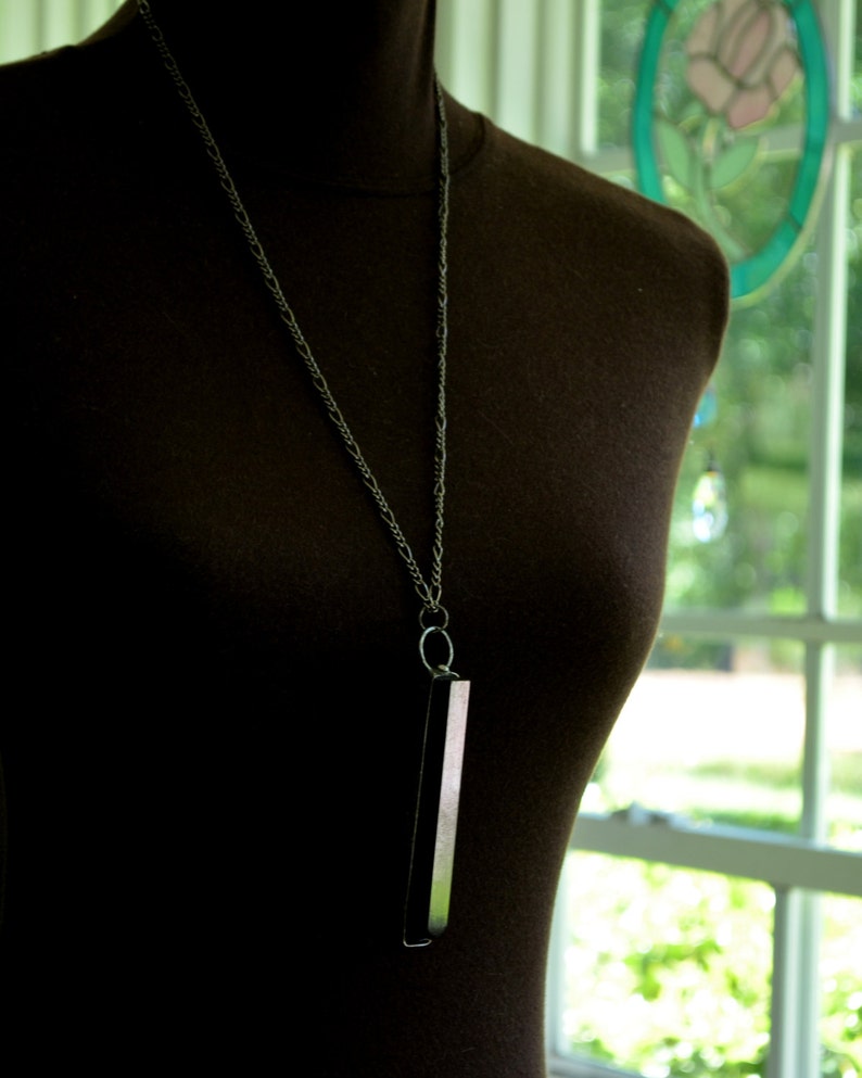 Piano Key Necklace, shown here on model to show length of chain, 100 year old black ebony key Handmade by Bayou Glass Arts into an interesting piece of jewelry. Best gift for piano or music teacher or any piano player in you life.