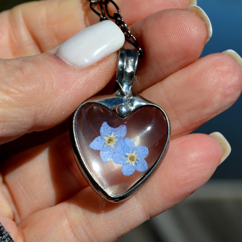Forget Me Not Heart Pendant Necklace Handmade by Artisan at Bayou Glass Arts. 2 dry pressed flower blooms encased in heart shaped cabochons. In remembrance. Best gift for Mom Grandma BFF Girlfriend Christmas Birthday Anniversary