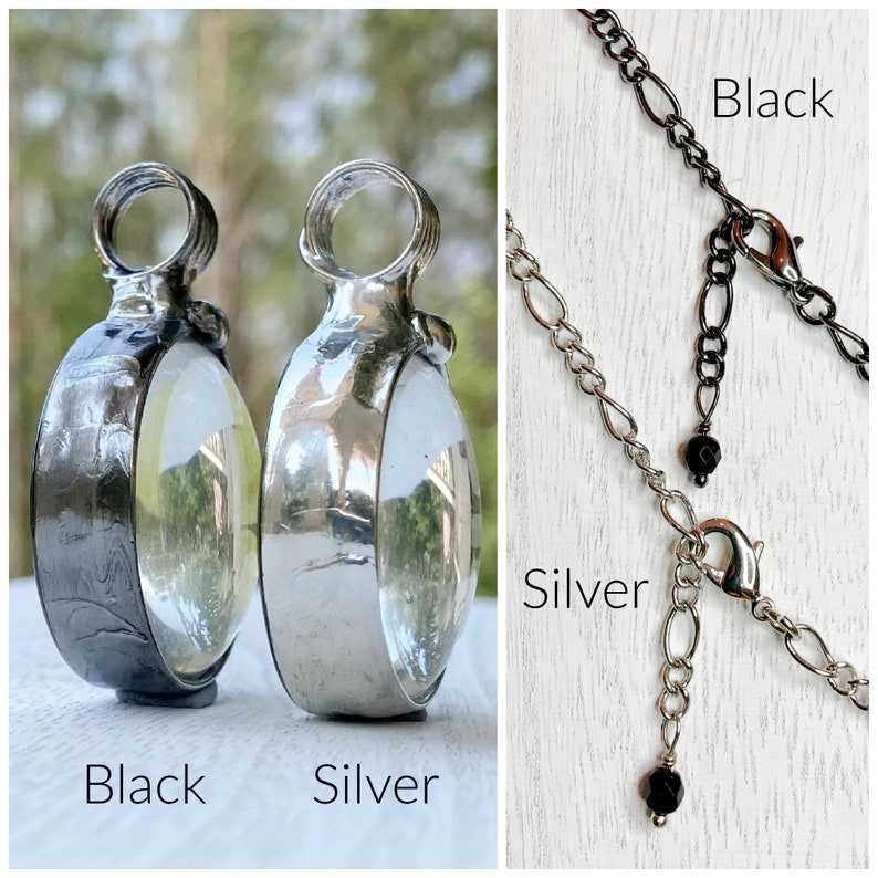 2 Bayou Glass Arts pendants side by side to show the difference in the finish. Left is gunmetal finish, right is shiny silver. The next image is of 2 Bayou Glass Arts necklace chains top is gunmetal finish, bottom is shiny silver finish.
