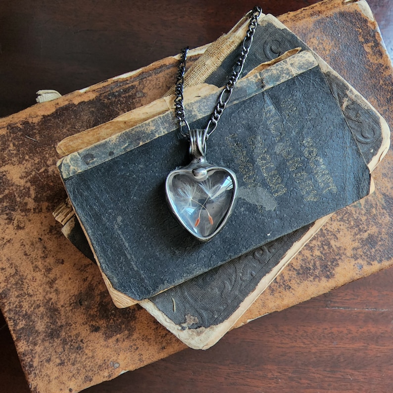 Handmade Dandelion Seed Heart Necklace Created by Artisans at Bayou Glass Arts. Shown with 2 seeds crossed inside Heart shaped Glass Cabochons. Best gift for Her Girlfriend Mom sister BFF Christmas Birthday Valentines Mothers Day