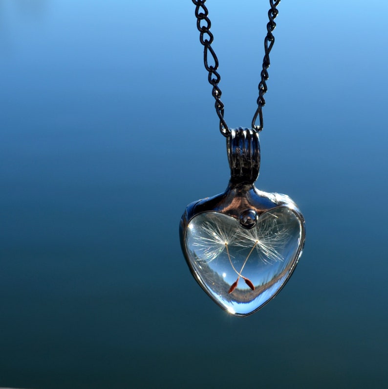 Handmade Dandelion Seed Heart Necklace Created by Artisans at Bayou Glass Arts. Shown with 2 seeds crossed inside Heart shaped Glass Cabochons. Best gift for Her Girlfriend Mom sister BFF Christmas Birthday Valentines Mothers Day