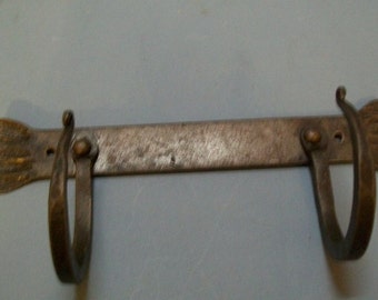 forged flat bar with 2 hand forge hooks riveted on