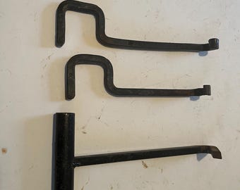 a set for reenactors -stake puller and 2 hooks that hook to vertical tent (2x2) to hold items