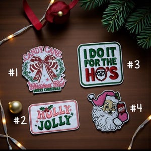 May include: Four festive embroidered patches. Patch #1 displays a candy cane bow with text "Candy Cane Christmas Club Merry Christmas". Patch #2 reads "Holly Jolly". Patch #3 says "I do it for the Ho's". Patch #4 depicts Santa Claus.