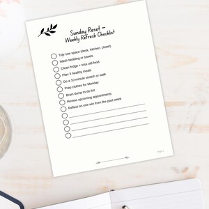 Sunday Reset Weekly Checklist page with leaf graphic show in calming desktop view