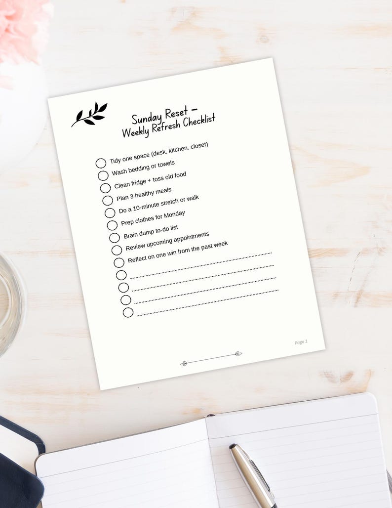 Sunday Reset Weekly Checklist page with leaf graphic show in calming desktop view