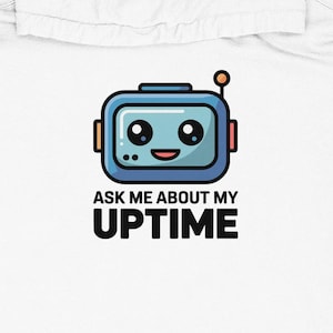 May include: White hoodie featuring a blue robot graphic with the text "ASK ME ABOUT MY UPTIME". The robot has a smiling face and antenna. The hoodie has a front pocket and a hood.