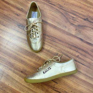 Shiny gold shop tennis shoes