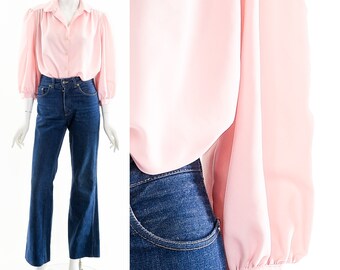 Blusa rosa bebé de manga abullonada