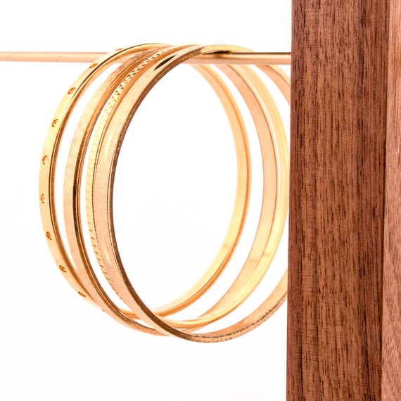 stack of gold bangles arm stack - image 6