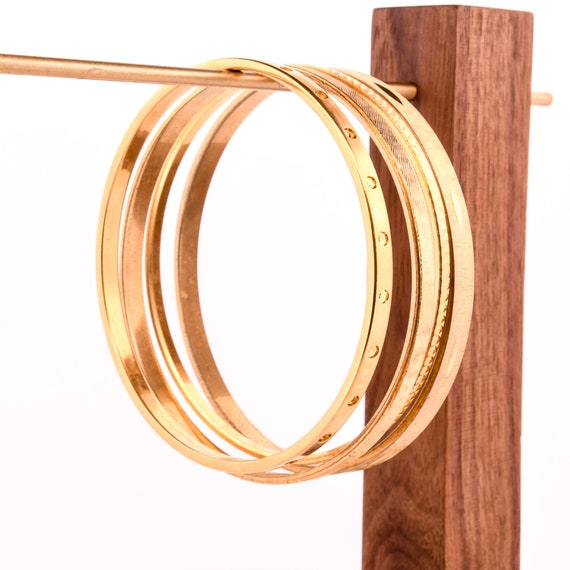 stack of gold bangles arm stack - image 4