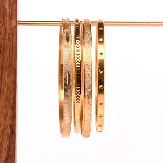 stack of gold bangles arm stack - image 1