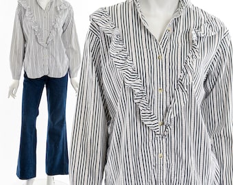 Blusa victoriana de algodón con volantes y botones.