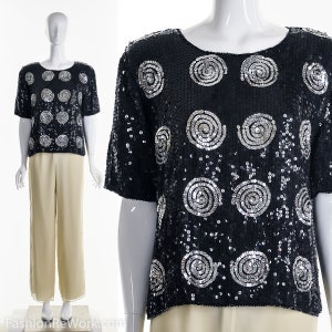 Blusa de seda preta com lantejoulas e redemoinho