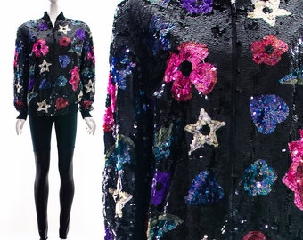 Chaqueta bomber con lentejuelas y estampado de estrellas y flores