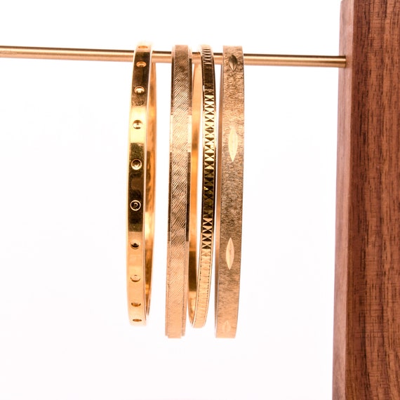 stack of gold bangles arm stack - image 5