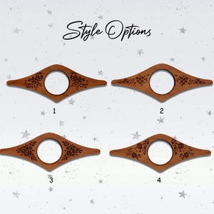 May include: Four wooden book page holders with floral designs and a central circular opening. The text "Style Options" is written in cursive at the top. Each holder is a different style, numbered 1 through 4.