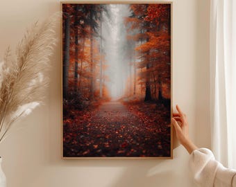 May include: A framed print of a forest path, with tall trees and vibrant autumn foliage in shades of orange and red. The path leads into a misty, light-filled distance. The artwork is displayed on a beige wall.