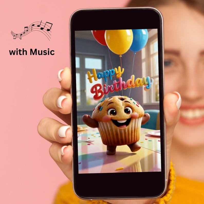 May include: A smartphone screen displays a digital illustration of a smiling, anthropomorphic cupcake character with colorful sprinkles. Above the cupcake, the text Happy Birthday appears in a stylized font, accompanied by red, yellow, and blue balloons.