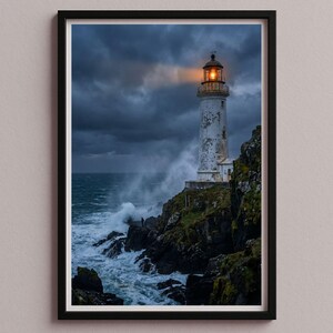 May include: A framed print of a lighthouse on a rocky cliff, with waves crashing against the shore. The lighthouse is white with a lit orange beacon. The sky is dark and stormy, creating a dramatic coastal scene.