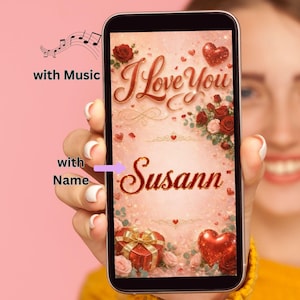May include: A smartphone screen displaying a digital graphic with the text I Love You and Susann in a cursive font. The background features red roses, sparkling red hearts, and a gift box with a gold ribbon. Text labels with Music and with Name are visible.